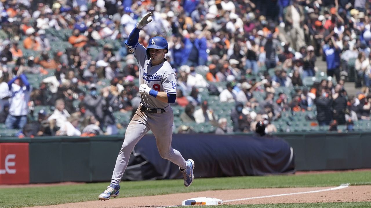 Los Angeles Dodgers' Gavin Lux rounds the bases after hitting grand slam against the San Francisco Giants during the third inning of a baseball game in San Francisco, Sunday, May 23, 2021. (AP Photo/Jeff Chiu)