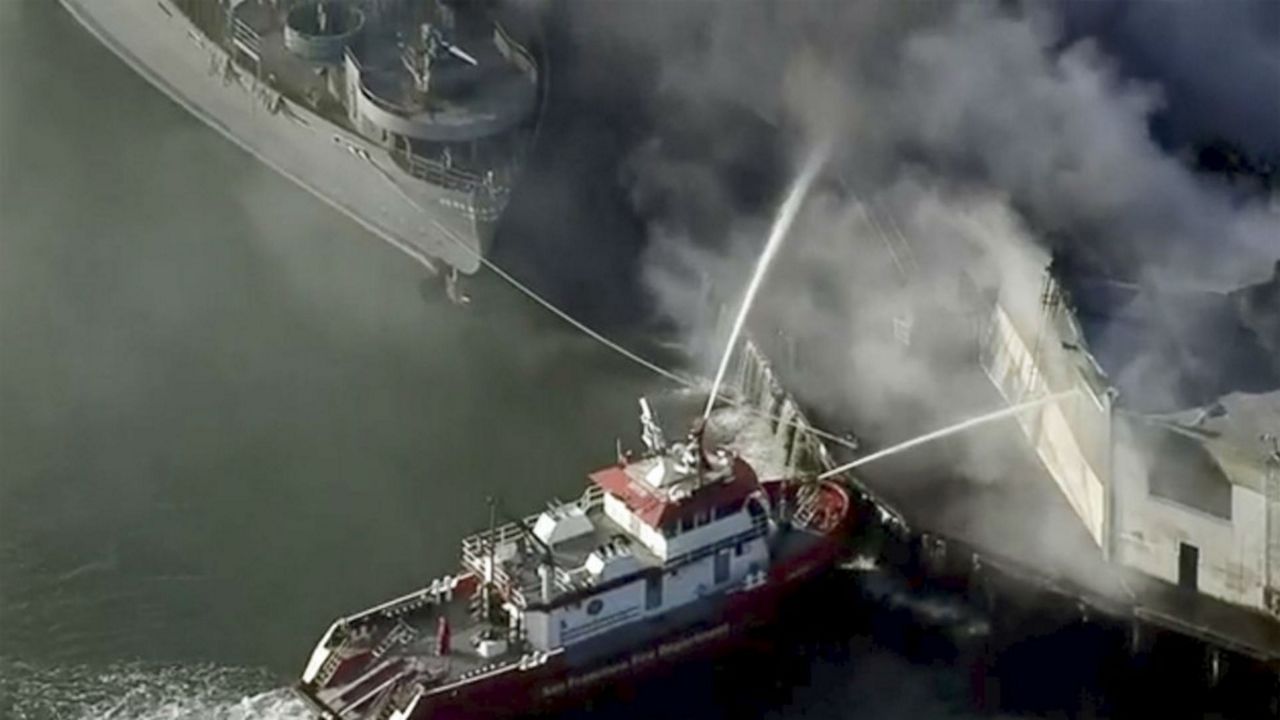 First responders battle a massive fire that erupted at a warehouse early Saturday, May 23, 2020 in San Francisco. Arriving crews were confronted with towering flames engulfing the warehouse. (KPIX-TV CBS-Viacom via AP)
