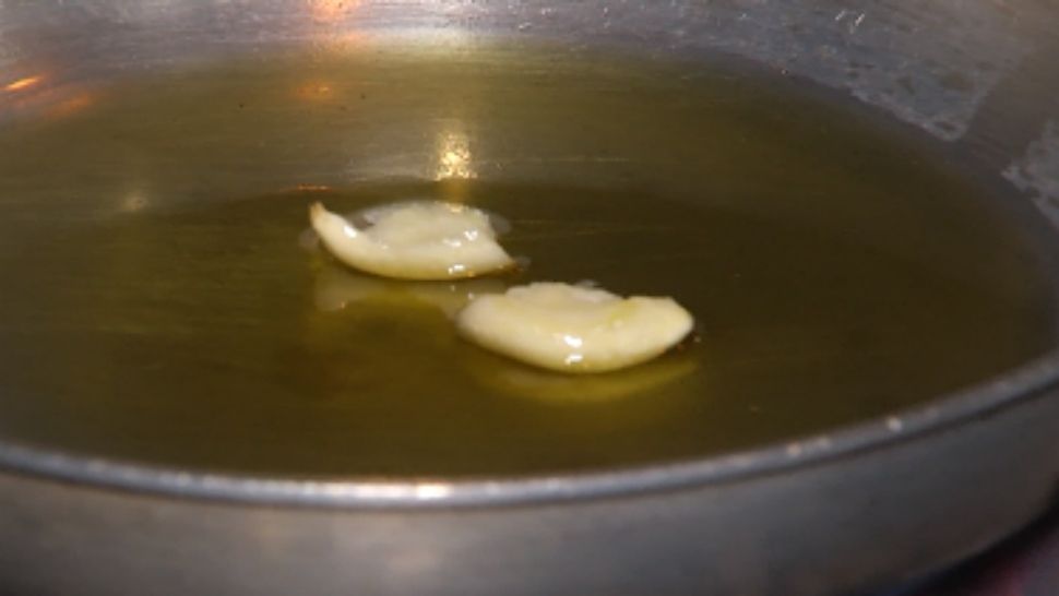 Tip: Chef cooks his garlic enough to release the oils, then discards the cooked cloves.