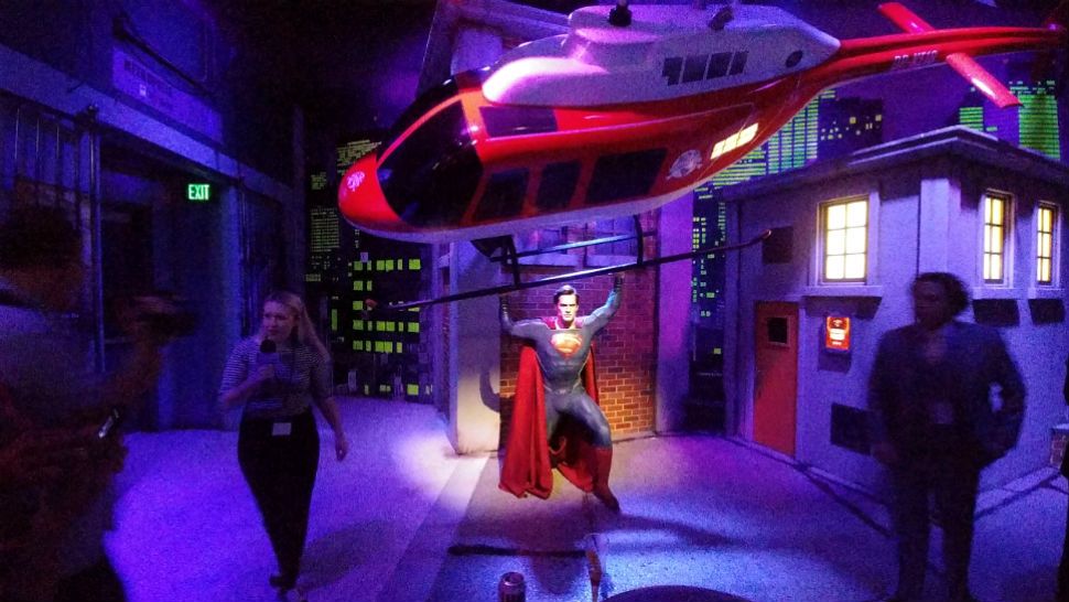 Superman catches a falling helicopter in the new Justice League: A Call for Heroes exhibit at Madame Tussauds Orlando. (Ashley Carter, staff)