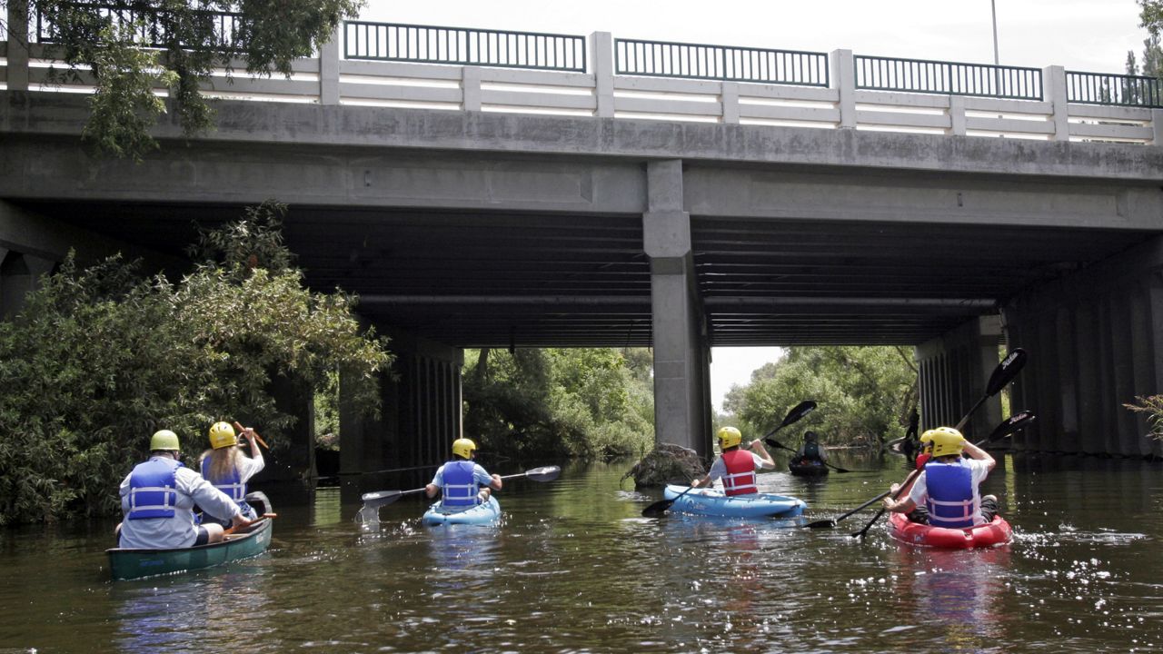Kayakers paddling down the Los Angeles River in the Sepulveda Dam recreation area in the Van Nuys district of Los Angeles. (AP Photo/Noaki Schwartz)
