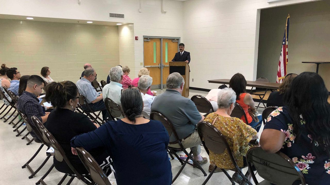 Attendees met at the Englewood Neighborhood Center to find out why each of them represents funding for the state. (Jesse Canales/Spectrum News)