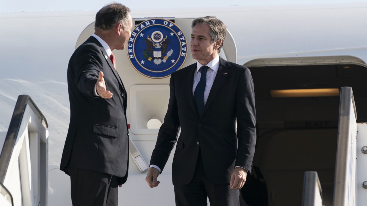 Secretary of State Antony Blinken, right, is greeted by Israeli Chief of State Protocol Gil Haskelas, as he steps off the plane upon arrival at Tel Aviv Ben Gurion Airport, Tuesday, May 25, 2021, in Tel Aviv, Israel. (AP Photo/Alex Brandon, Pool)