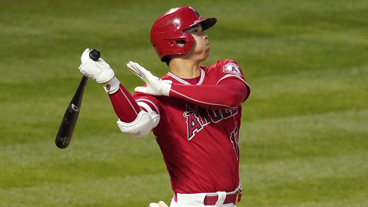 Los Angeles Angels' Shohei Ohtani hits a three-run home run during the fourth inning of a baseball game against the Texas Rangers Tuesday, May 25, 2021, in Anaheim, Calif. (AP Photo/Mark J. Terrill)