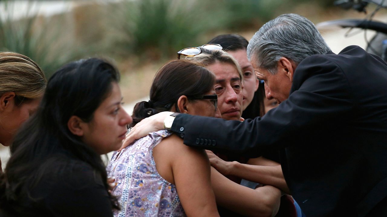 The archbishop of San Antonio, Gustavo Garcia-Siller, comforts families outside the Civic Center following a deadly school shooting at Robb Elementary School in Uvalde, Texas, Tuesday, May 24, 2022. (AP Photo/Dario Lopez-Mills)