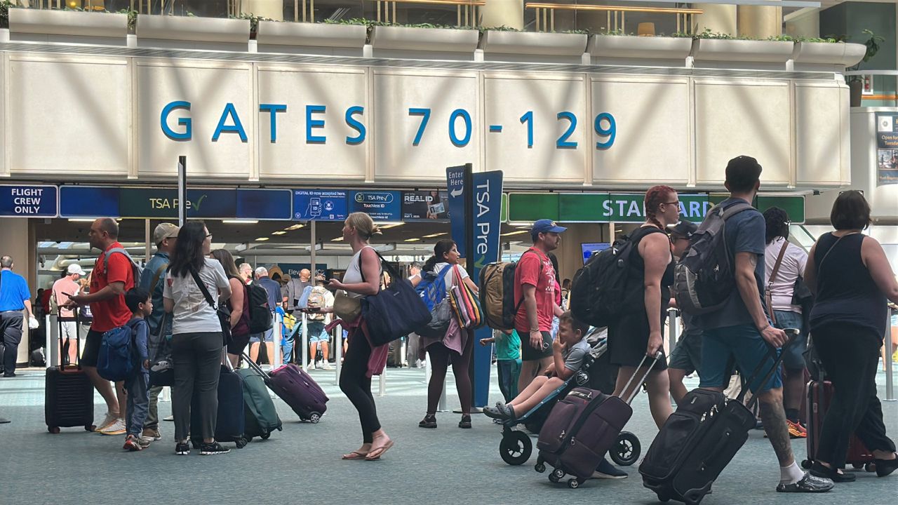 Passengers at Orlando International Airport on Monday. (Spectrum News/Nick Allen)