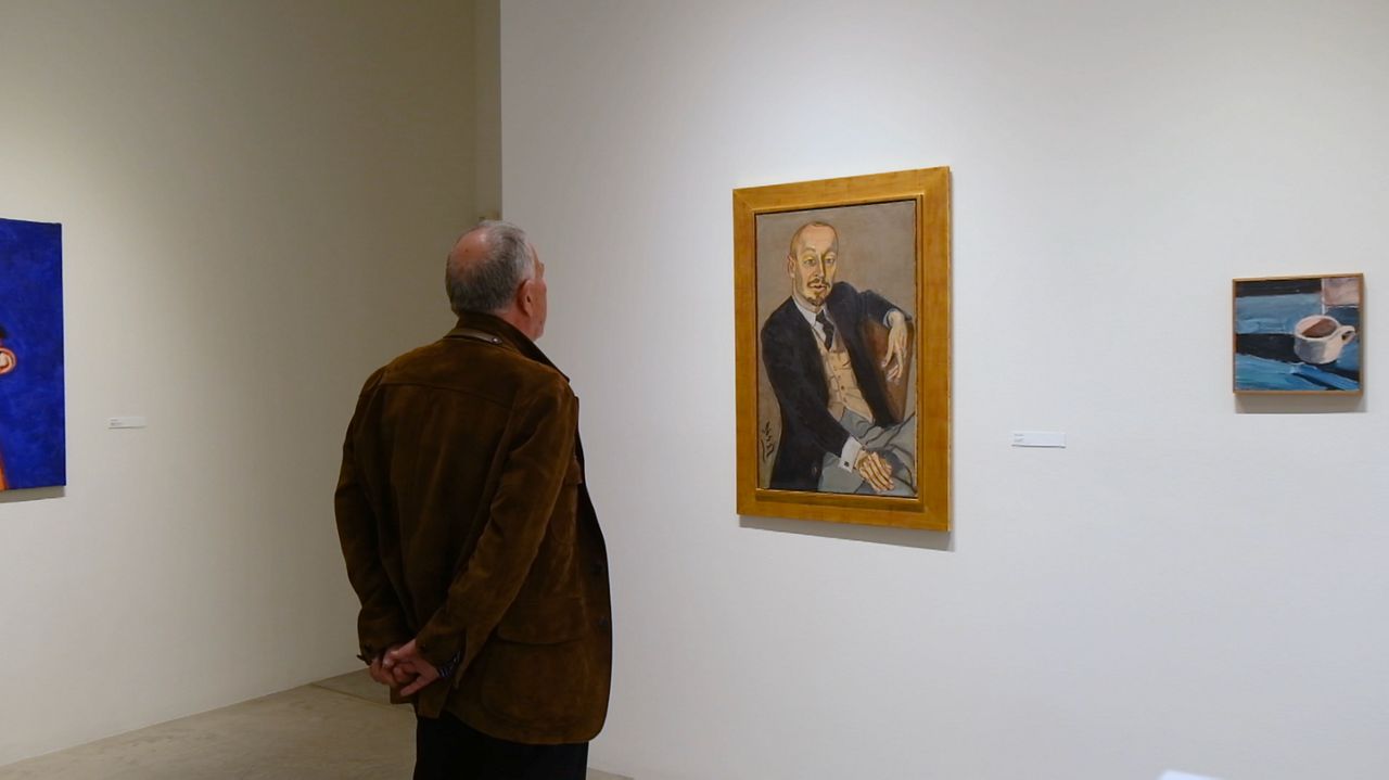 Peter Goulds looking at a painting at his LA Louver gallery in Venice, CA.
