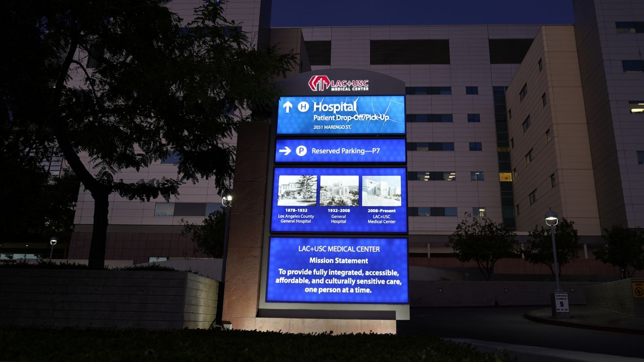 The Los Angeles County+USC Medical Center's patient drop-off/pick-up area is seen in Los Angeles, late Wednesday, Dec. 16, 2020. (AP Photo/Damian Dovarganes)