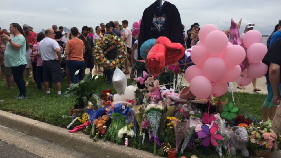 Family and friends of Jessica Raubenolt gathered at a memorial on Bayshore Boulevard to remember the young mother who was hit and killed Wednesday. (Katie Jones, staff)
