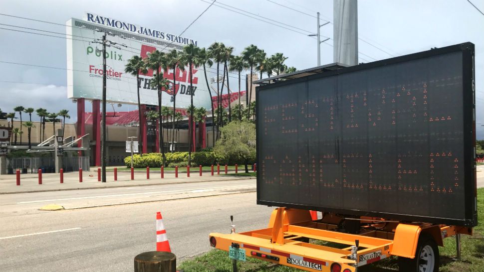 Sign outside Raymond James Stadium announcing the cancellation of the Sunset Music Festival. (Trevor Pettiford, staff)