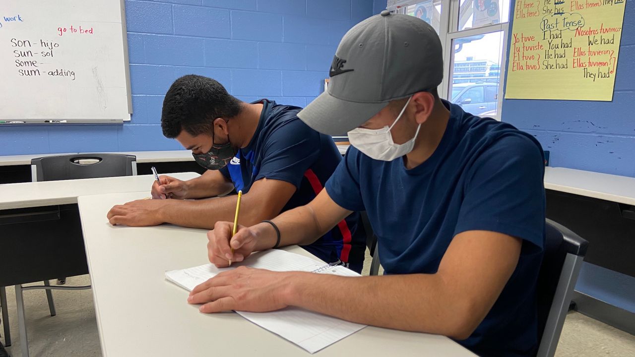 Jose and Kevin study English at the Backside Learning Center. (Spectrum News 1 KY/Adam K. Raymond)
