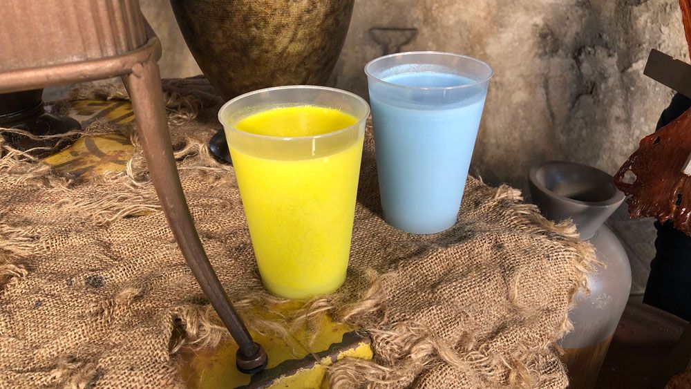 Green Milk and Blue Milk at Star Wars: Galaxy's Edge at Disneyland. Alcoholic versions of the drinks will be offered at Galaxy's Edge at Disney World. (Ashley Carter/Spectrum News)