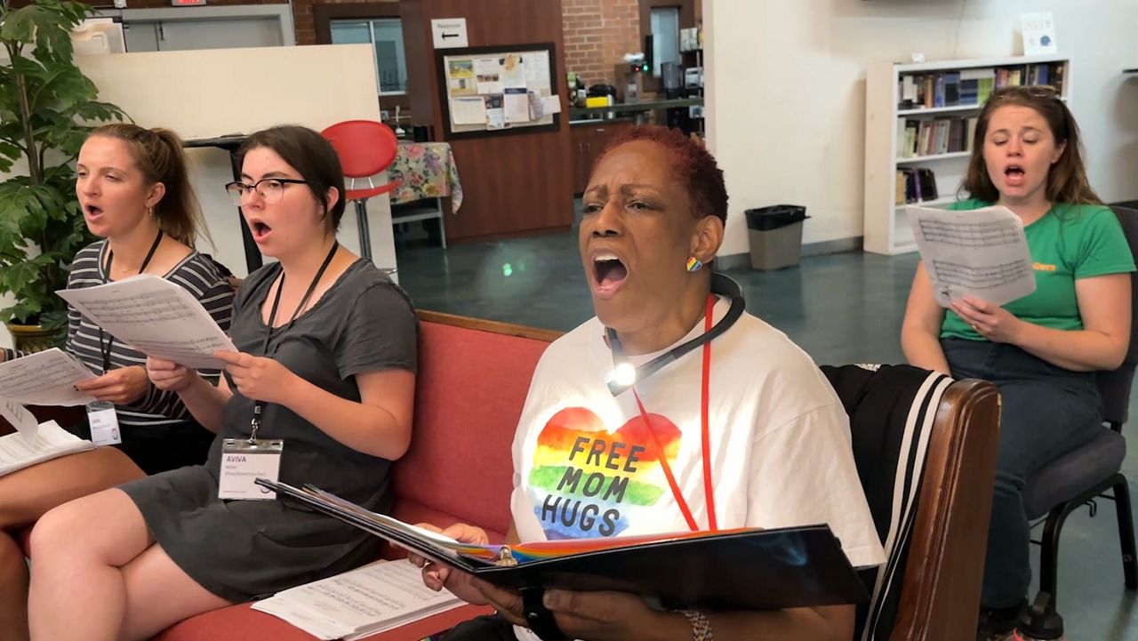 A group of singers in rehearsal. (Spectrum News/Kristopher Gee)