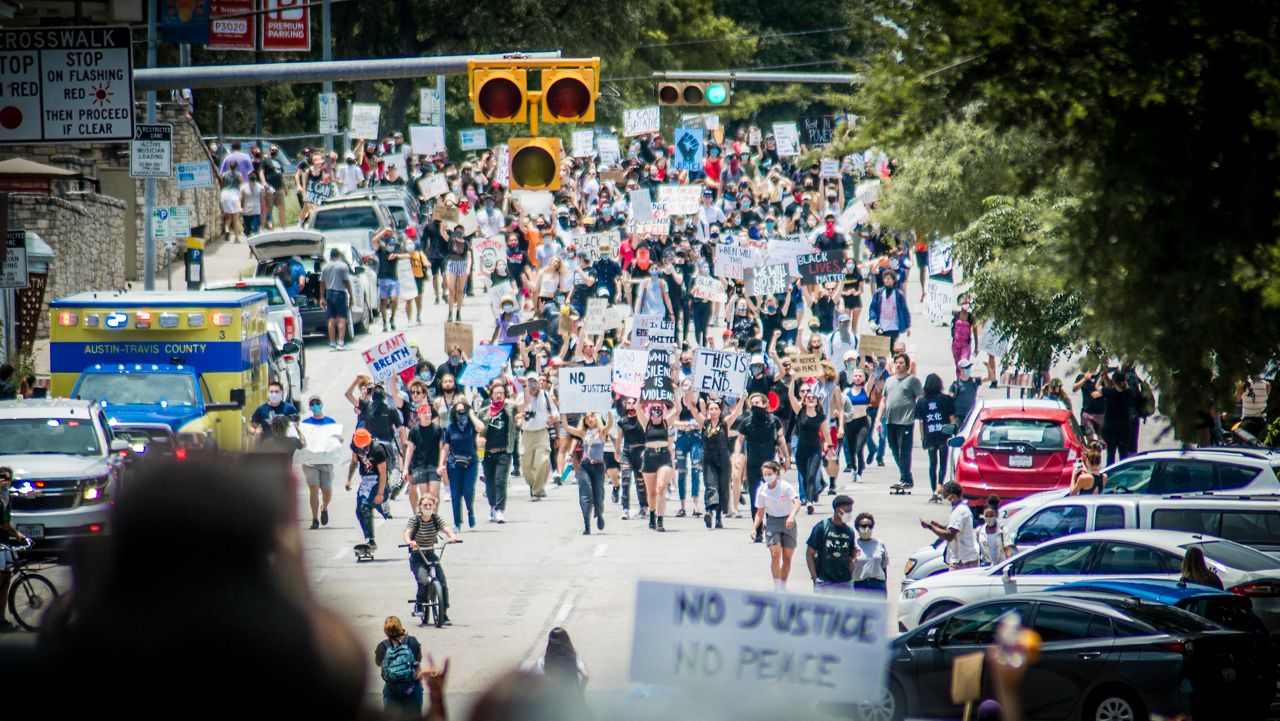 People protest in Austin over police killings.