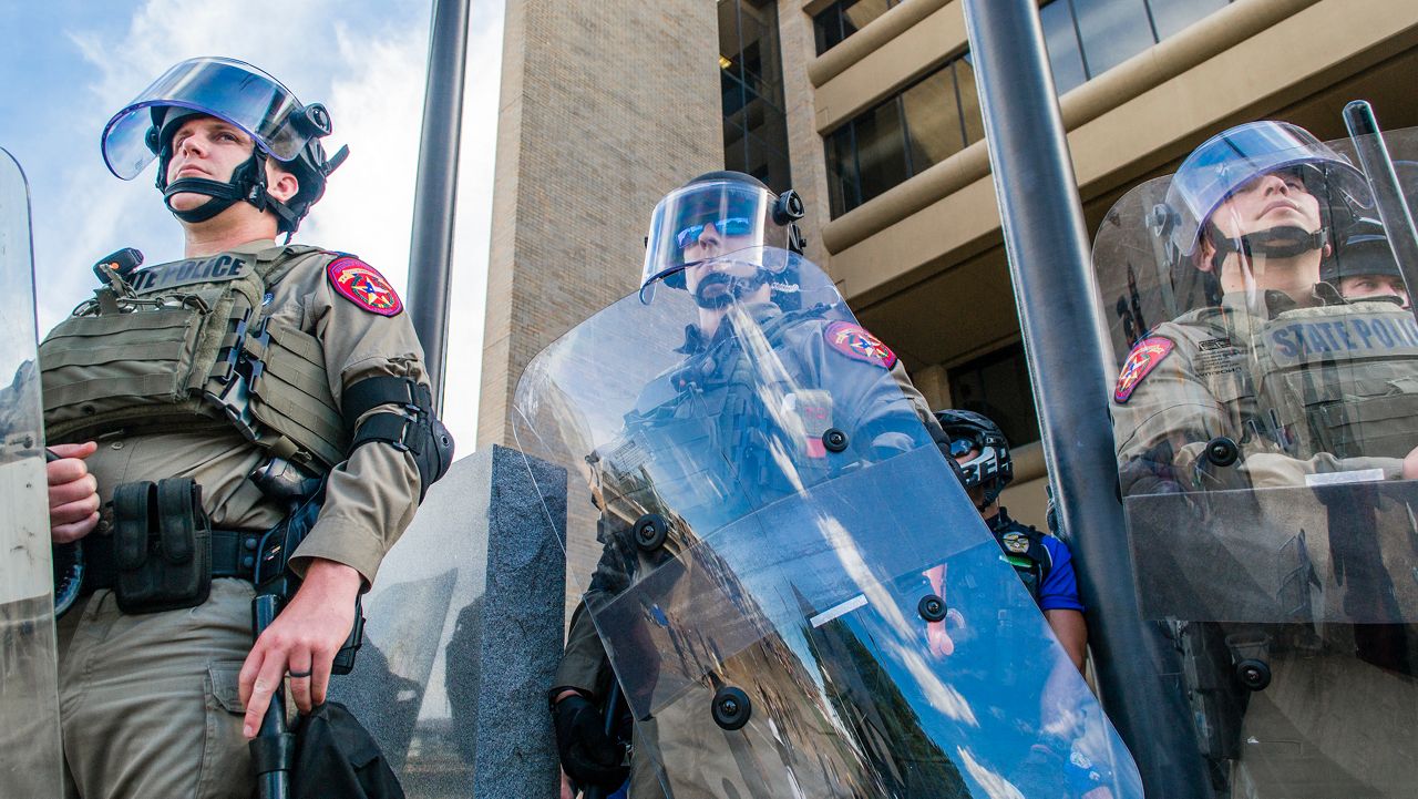 People protest in Austin over police killings.