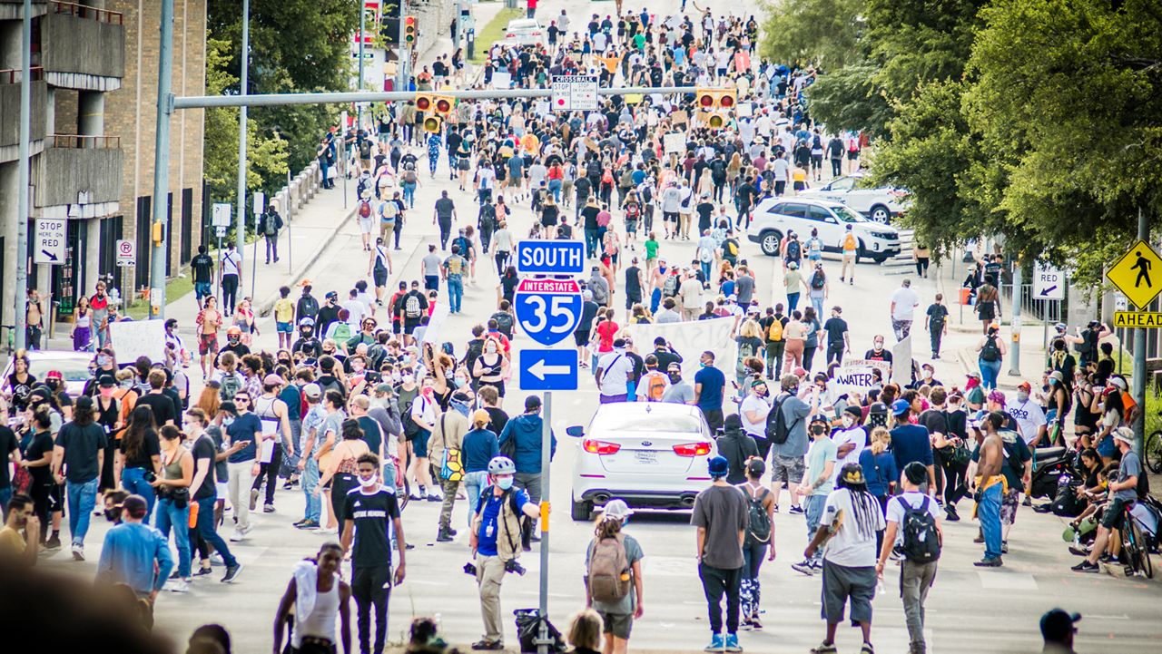 People protest in Austin over police killings.