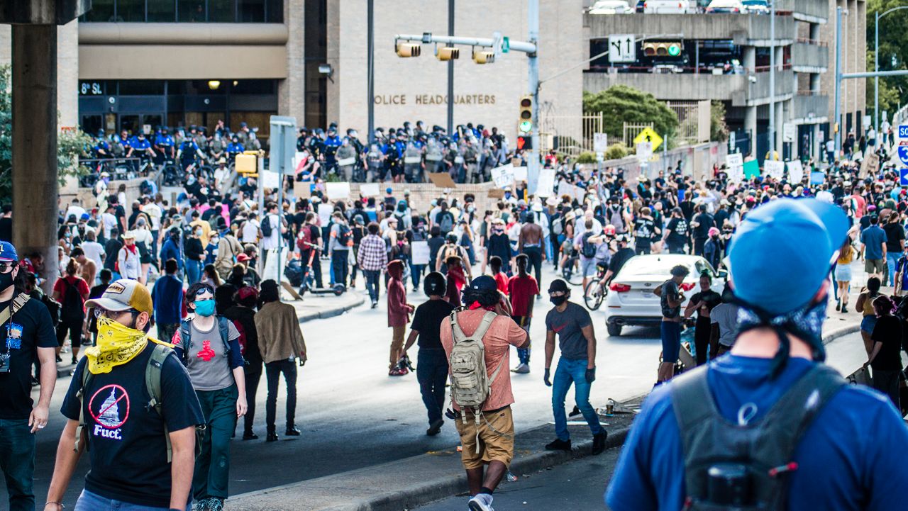 People protest in Austin over police killings.