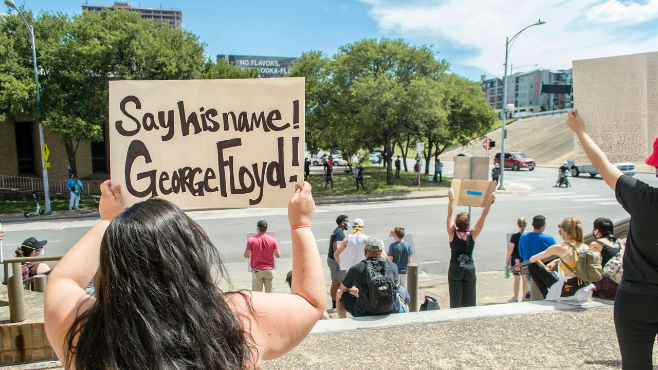 People protest in Austin over police killings.