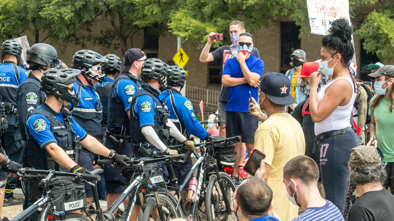 People protest in Austin over police killings.