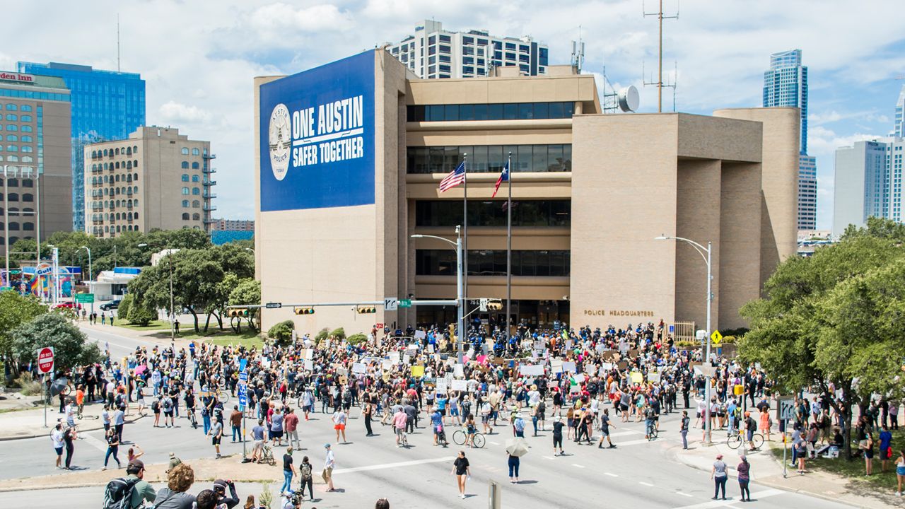 People protest in Austin over police killings.