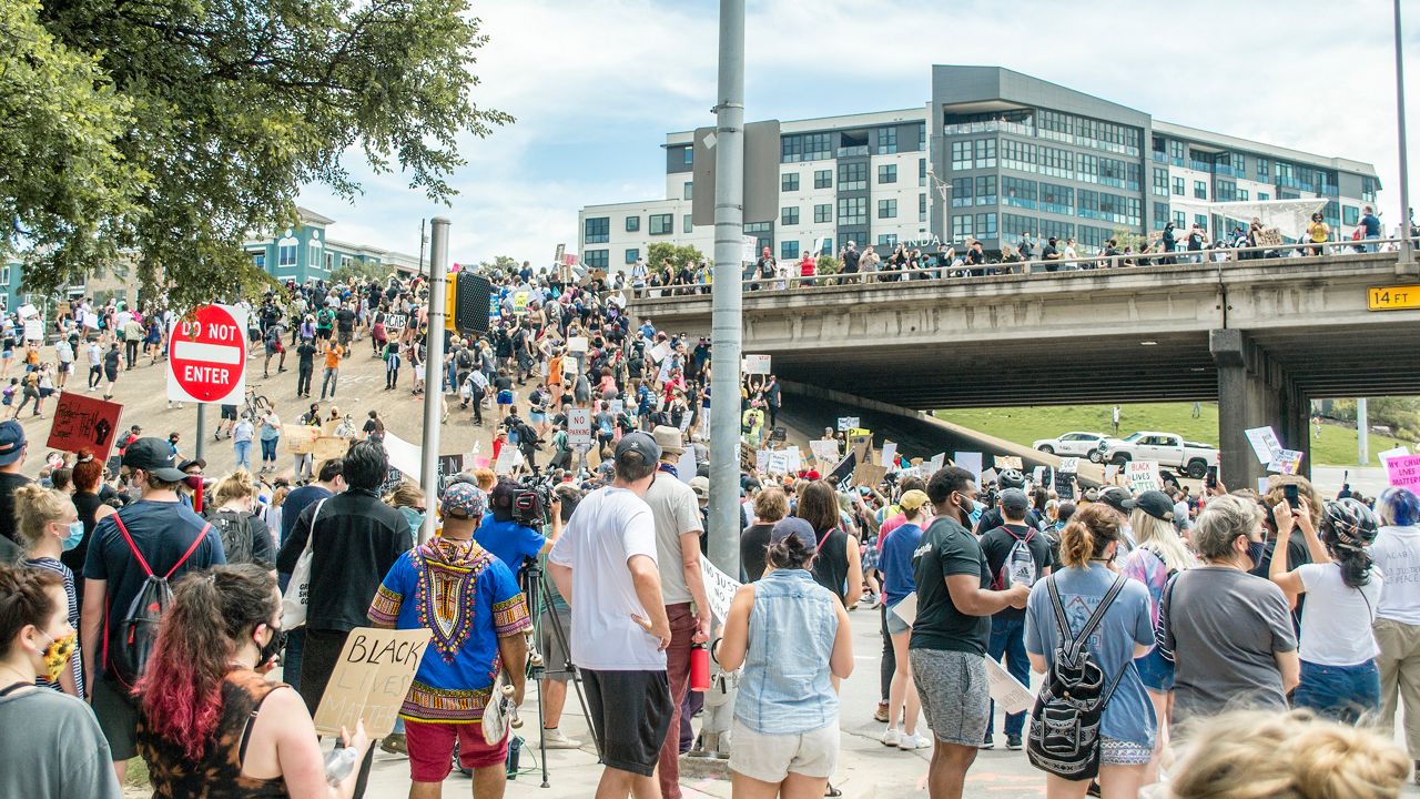 People protest in Austin over police killings.