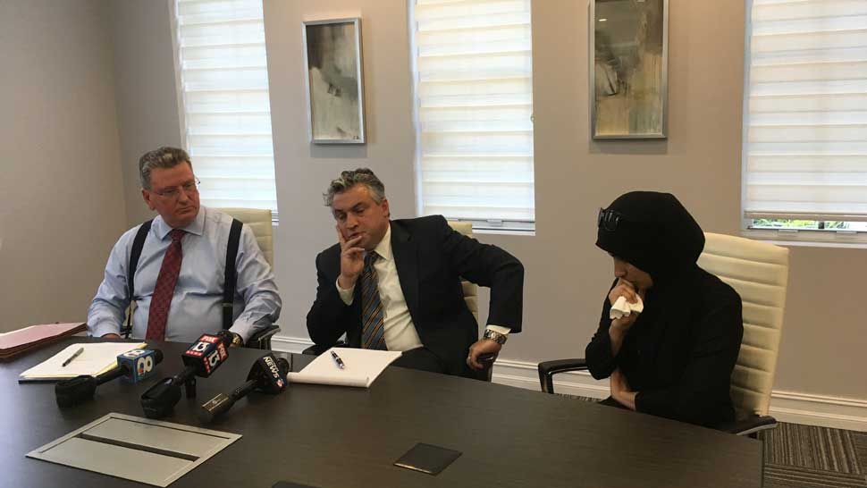 Huda Salim Kareem (right) pauses while speaking to assembled media with one of her attorneys serving as a translator, Thursday, May 30, 2019. Kareem's husband, Rafat Saeed, was shot and killed in the parking lot of the Islamic Society of Tampa Bay on May 20. (Laurie Davison/Spectrum Bay News 9)