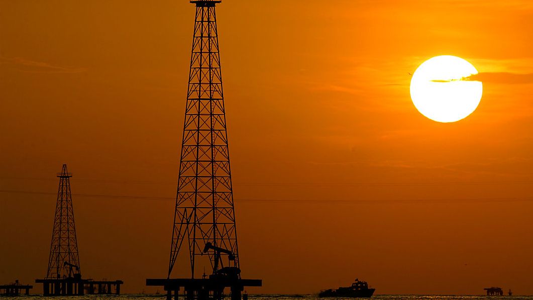 FILE - This Nov. 30, 2006 file photo shows oil drills in Maracaibo Lake in Venezuela's oil rich Zulia state. The Biden administration on Tuesday, June 1, 2021, gave Chevron Corp. and several other American companies six more months to wind down their operations in Venezuela. The special license exempting the companies from U.S. sanctions comes as the Biden administration reviews the U.S. policy that seek to starve President NicolÃ¡s Maduro's socialist government of badly needed oil revenue. (AP Photo/Leslie Mazoch, File)