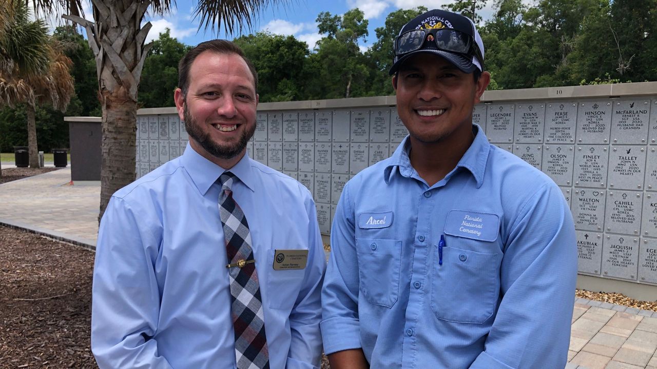 Adrian Ramsey and Arcel Sabilona are both Marine veterans, and work at Florida National Cemetery in Bushnell. (Spectrum News/Erin Murray)