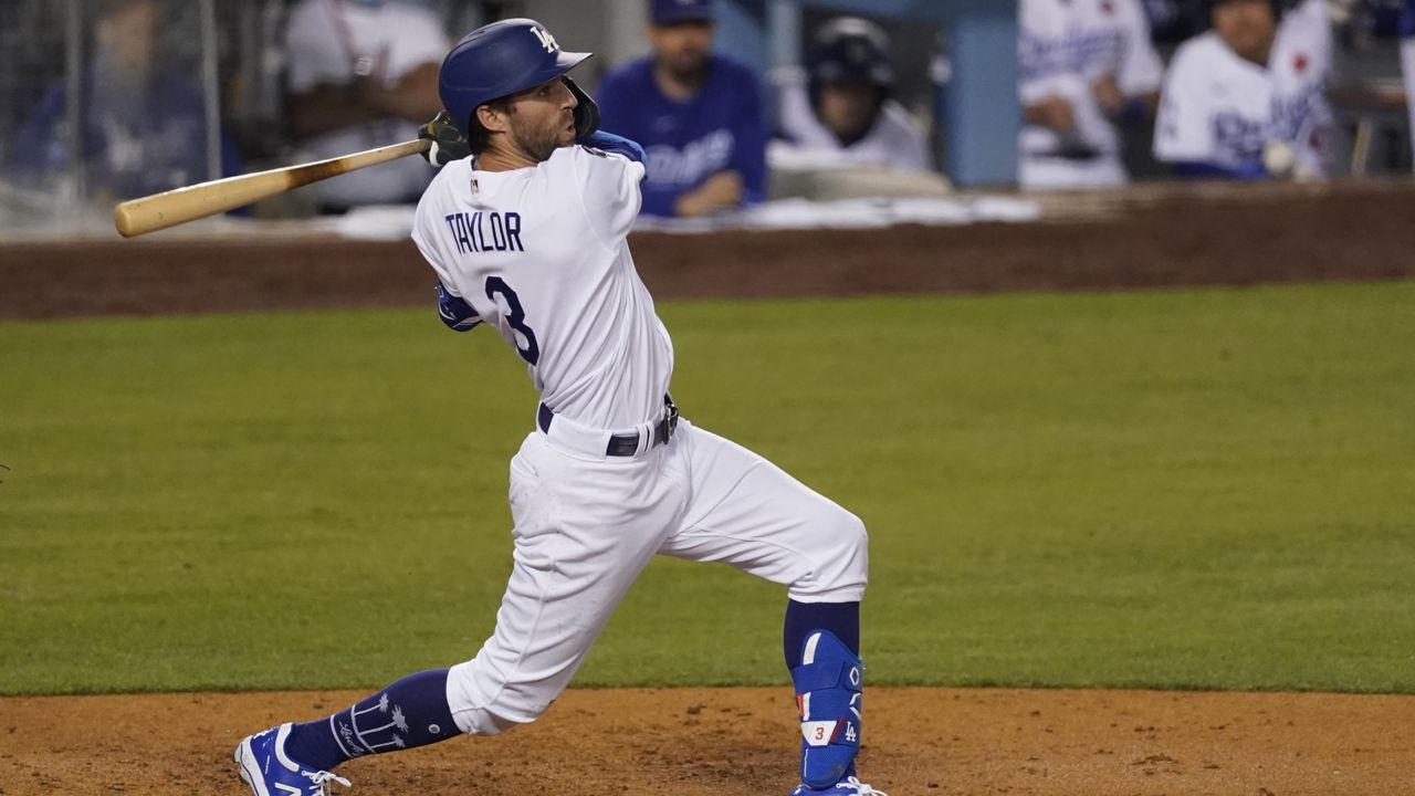 Los Angeles Dodgers' Chris Taylor (3) doubles during the sixth inning of a baseball game against the St. Louis Cardinals Monday, May 31, 2021, in Los Angeles. Justin Turner, Cody Bellinger and Will Smith scored. (AP Photo/Ashley Landis)
