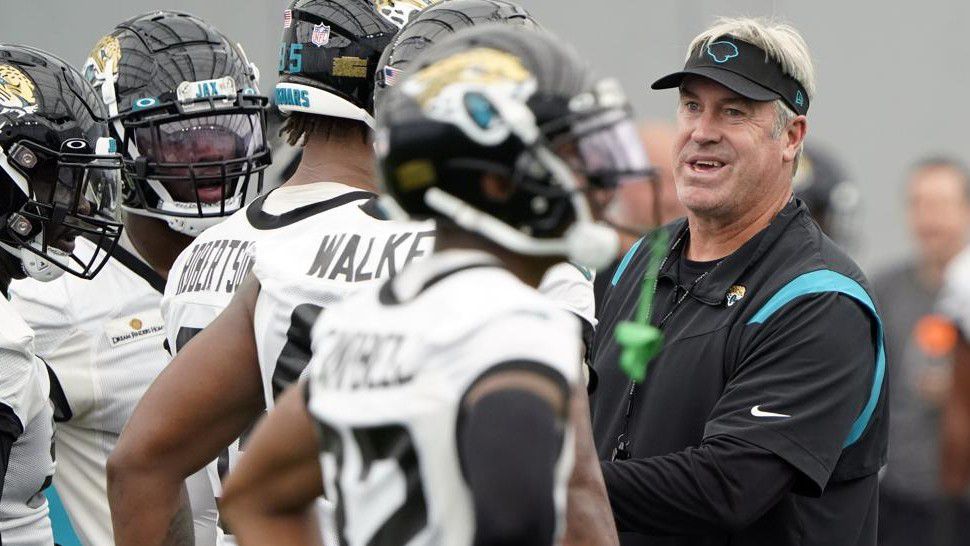 Jacksonville Jaguars head coach Doug Pederson, right, talks with players during an NFL football practice, Tuesday, May 31, 2022, in Jacksonville, Fla. (AP Photo/John Raoux)