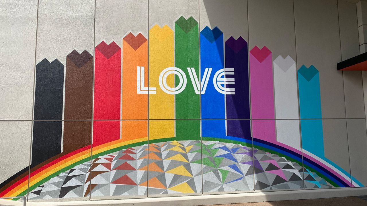 A Pride mural outside Connections Cafe at EPCOT for Pride Month. (Spectrum News/Ashley Carter)
