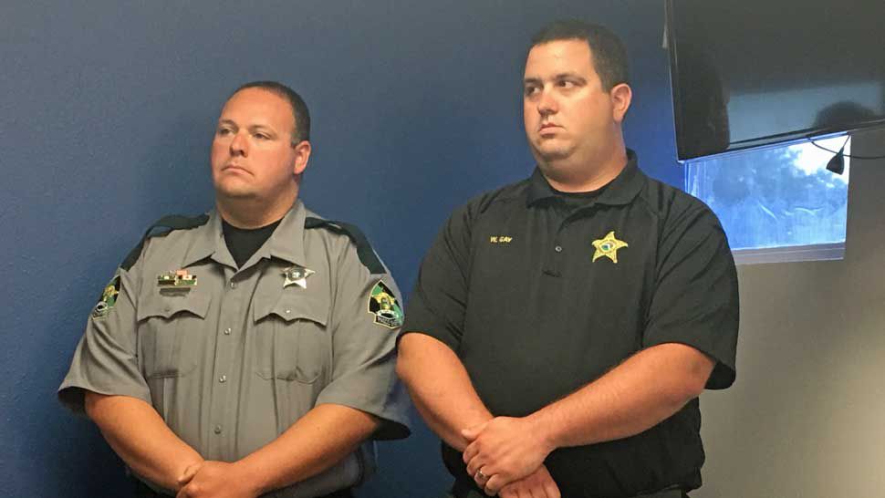 Left to right: Pasco Detention Deputies Sean Powers and William Gay helped rescue a family of fishermen from Ocala whose boat sank in the Gulf of Mexico on May 8. The two deputies were off-duty at the time of the rescue. (Dalia Dangerfield/Spectrum Bay News 9)