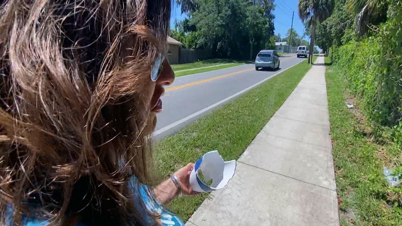 Kristen King with Keep Pasco Beautiful walks to cleanup route for World Ocean Day. (Spectrum Bay News 9)