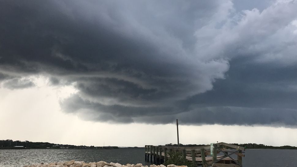 Sent to us via the Spectrum News 13 app: Dark clouds were seen over the Little Beach in Edgewater on Monday, June 11, 2018. (Alicia Watson, viewer)