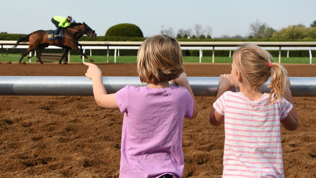 Young fans take in the horses training at Keeneland (Keeneland)