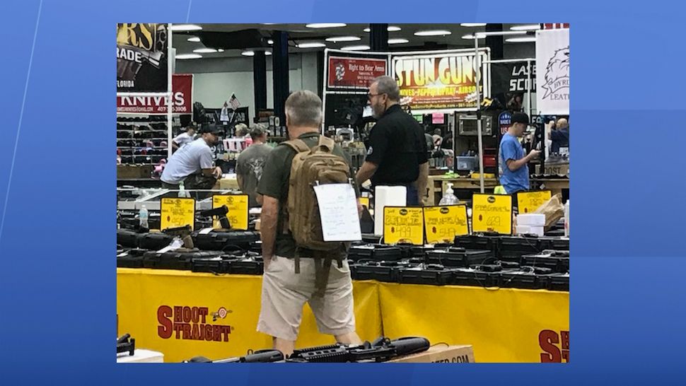 It's a big day for business for Mike Wilcox and his team with Shoot Straight. Their booth is one of the largest at the Florida Gun Show, which is spending the weekend at the Florida State Fairgrounds. (Angie Angers, staff)