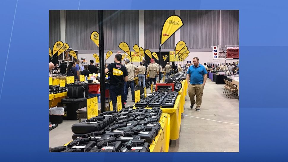 It's a big day for business for Mike Wilcox and his team with Shoot Straight. Their booth is one of the largest at the Florida Gun Show, which is spending the weekend at the Florida State Fairgrounds. (Angie Angers, staff)