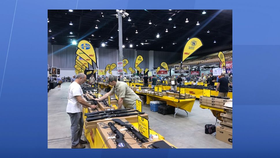 It's a big day for business for Mike Wilcox and his team with Shoot Straight. Their booth is one of the largest at the Florida Gun Show, which is spending the weekend at the Florida State Fairgrounds. (Angie Angers, staff)