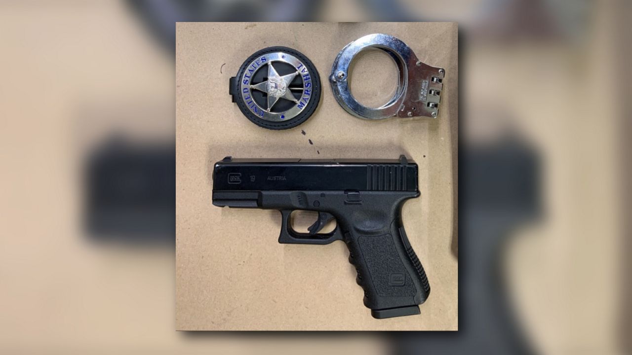 Federal prosecutors say these items were confiscated from John Wesley Mobley Jr., who's accused of impersonating a U.S. marshal during an Orlando protest. (United States Attorney’s Office for the Middle District of Florida)