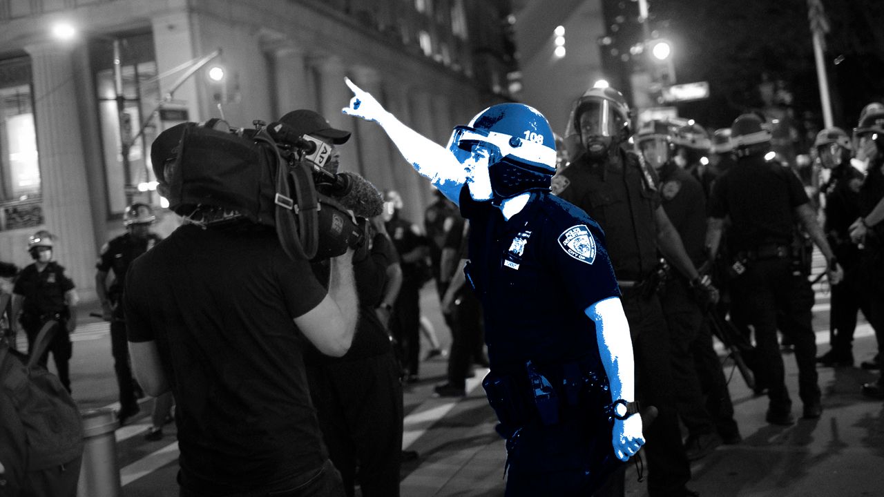 New York City Police Confront an Associated Press photographer during a protest. (AP)