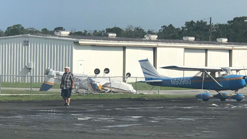 One of several planes flipped over at Space Coast Regional Airport in Titusville Monday. (Greg Pallone, Staff)