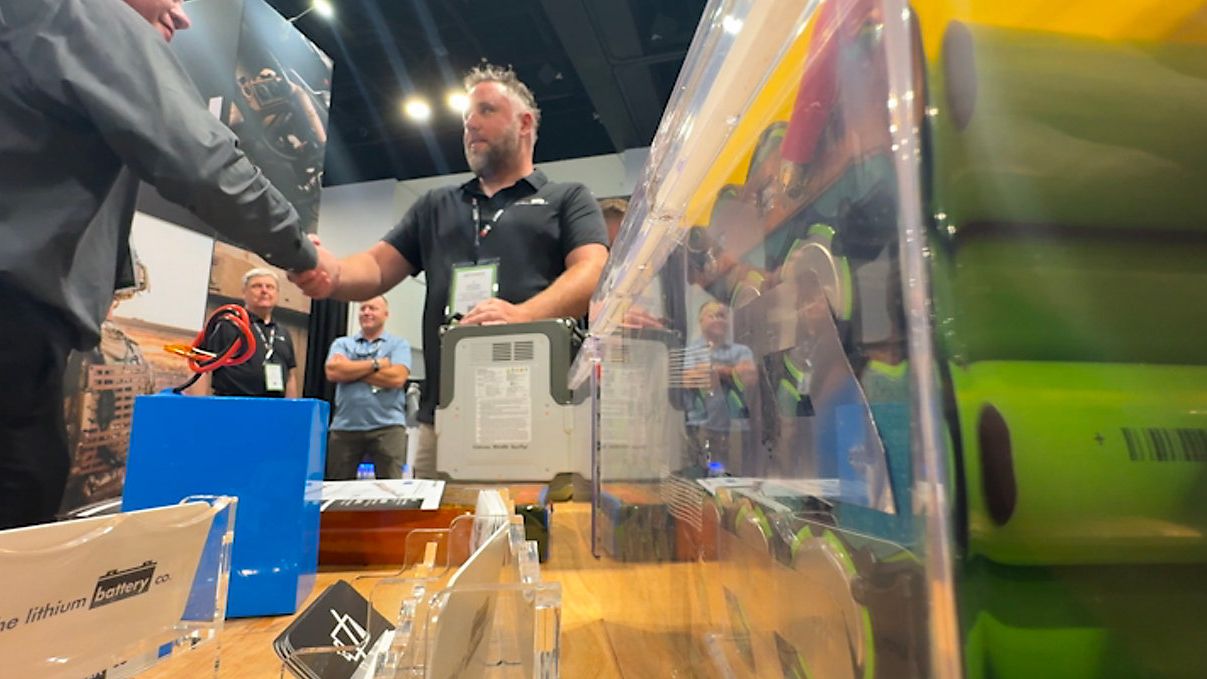 CEO Nathan Staron shows off some of the battery packs Lithium Battery Company manufactures. (Spectrum Bay News 9/Jeff Van Sant)