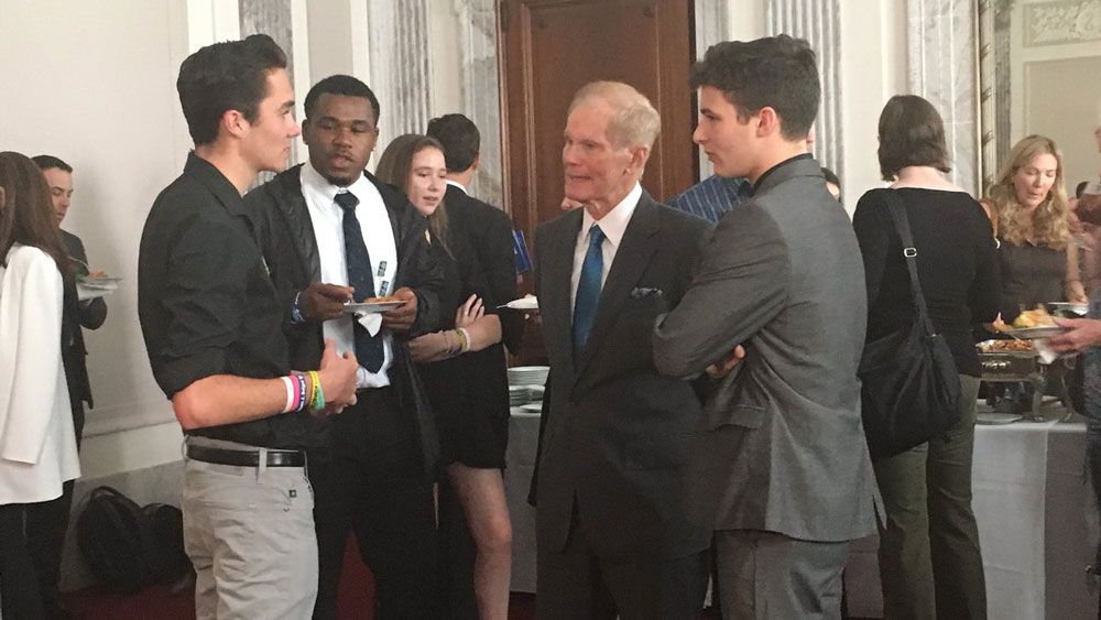Sen. Bill Nelson speaks with students from March For Our Lives, including David Hogg (left) and Cameron Kasky (right), at the the Robert F. Kennedy Human Rights Award ceremony Tuesday. (Samantha-Jo Roth, Staff) 