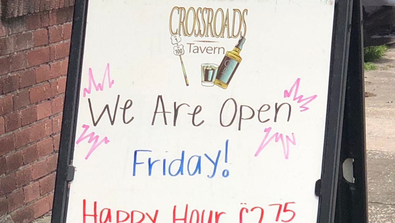 Crossroads Tavern put out its sign for the first time since St. Patrick's Day Friday. (Nicole Griffin, Spectrum News)