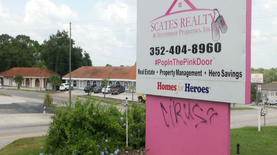 Someone spray-painted the word "virus" on the sign outside Scates Realty on East Highway 50 in Clermont. (Sarah Panko, staff)
