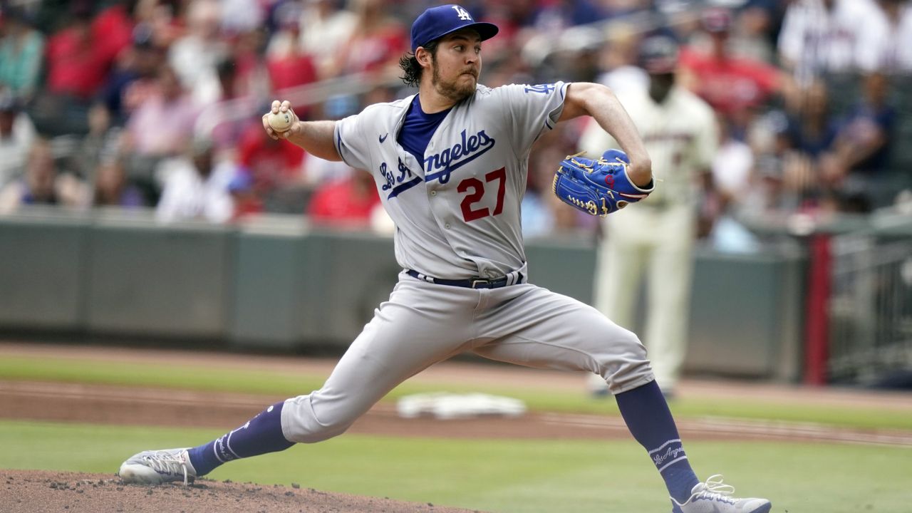 Los Angeles Dodgers starting pitcher Trevor Bauer (27) throws to an Atlanta Braves batter in the first inning of a baseball game Sunday, June 6, 2021, in Atlanta. (AP Photo/Brynn Anderson)
