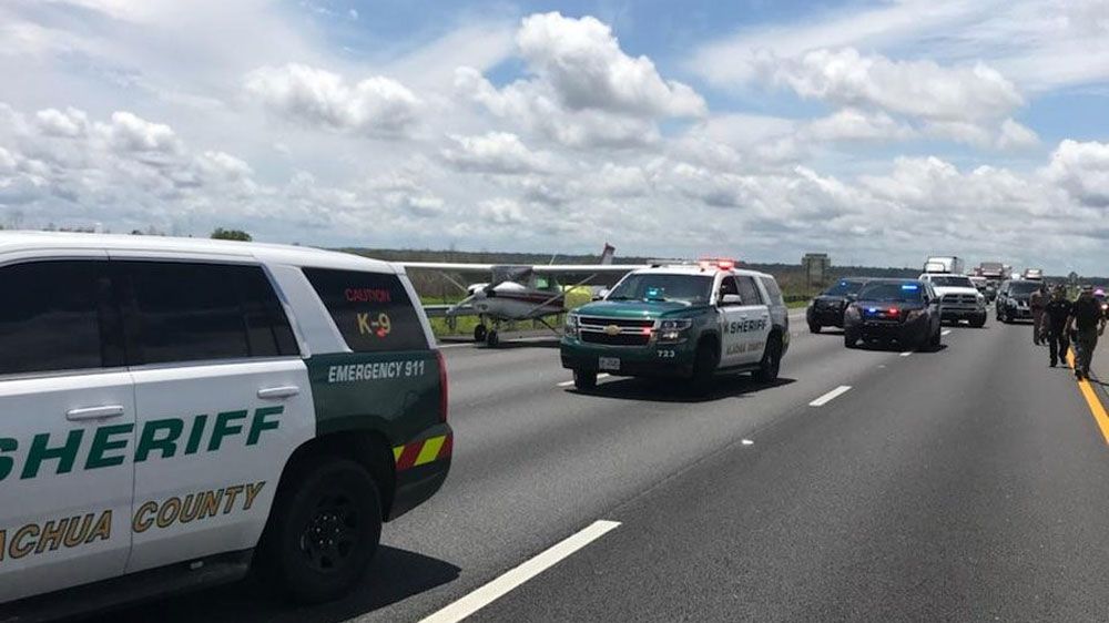 A small plane landed on I-75 in Alachua County Thursday, snarling traffic on the interstate for several hours. (Alachua County Sheriff's Office)
