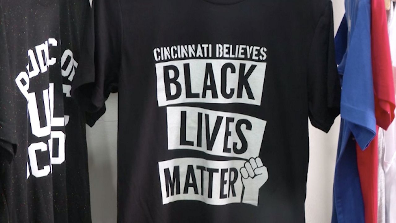 Cincinnati Believes Black Lives Matter T-Shirts hanging on rack