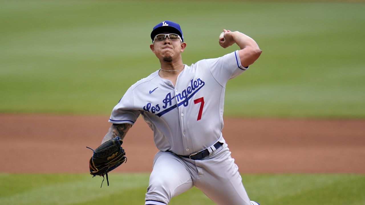 Los Angeles Dodgers starting pitcher Julio Urias (7) delivers during the first inning of a baseball game against the Pittsburgh Pirates in Pittsburgh, Thursday, June 10, 2021. (AP Photo/Gene J. Puskar)