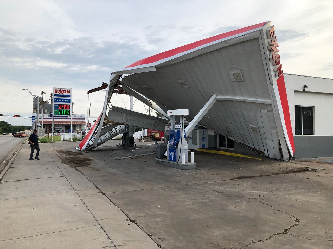 The roof of an Exxon Gas Station was destroyed by strong winds in Lockhart, Texas on Sunday. 